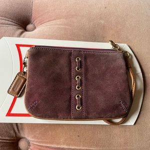 Plum suede coach wristlet